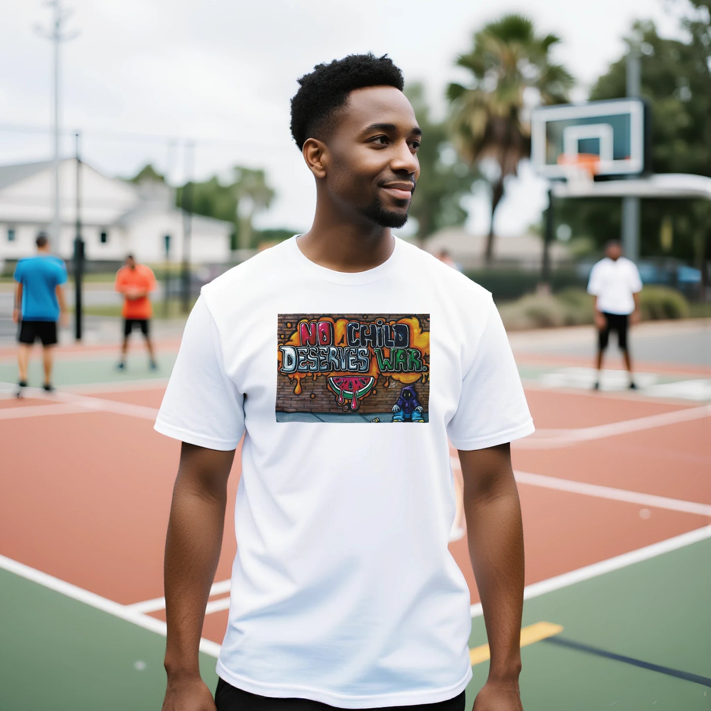 Man wearing a white t-shirt with a colorful graphic on a basketball court